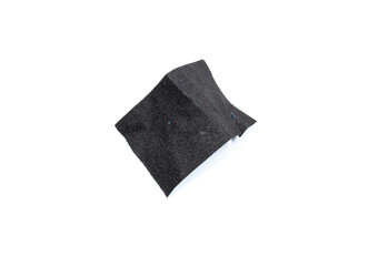 Naklejka premium Used and creased black sandpaper.