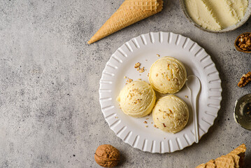 ice cream in balls with nuts and cones