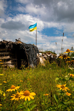 The flag of Ukraine flies over Ukrainian positions in the combat zone. War in Ukraine.
