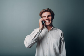 Portrait european young man portrait with mobile phone