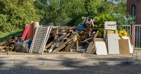 Bulky garbage heap at the roadside with furniture