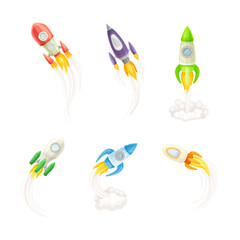 Rockets flying with smoke and fire set cartoon vector illustration