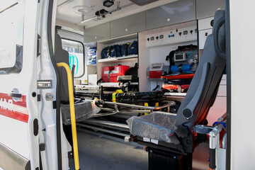 Interior of an ambulance car: stretcher, bags, other medical equipment