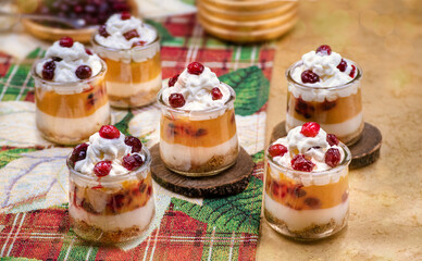 Christmas pumpkin and cramberry mousse served in individual glasses