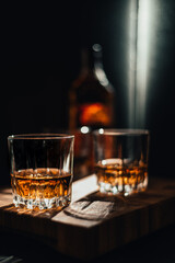 Glass of whiskey and ice - stock photo