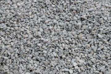 Road construction gravel texture , close up on pile of gravel for construction of a road at a construction site. Road construction background