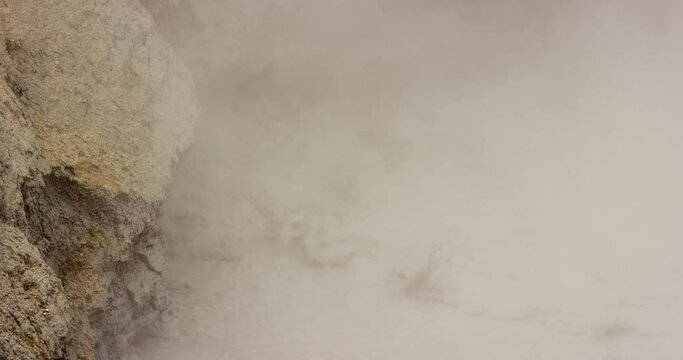 A bubbling mud volcano called Dragon's Mouth Spring in Yellowstone National Park