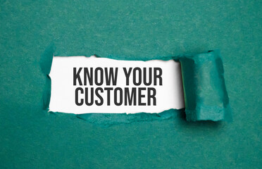 The word Know Your Customer is standing on a blue background, ripped paper