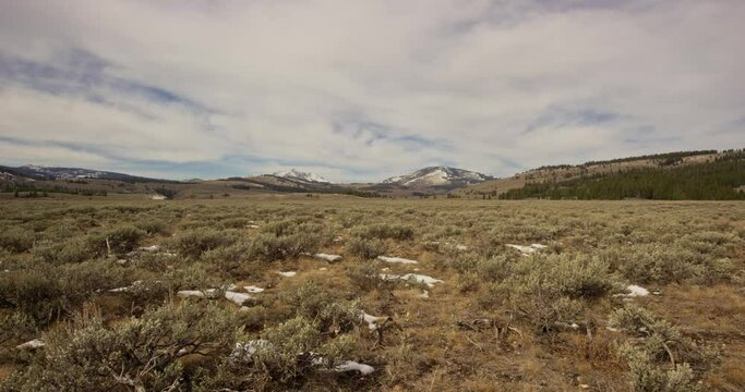Large open plain slightly covered with snow in Yellowstone National Park