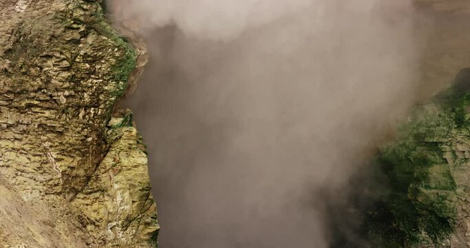 A bubbling mud volcano called Dragon's Mouth Spring in Yellowstone National Park