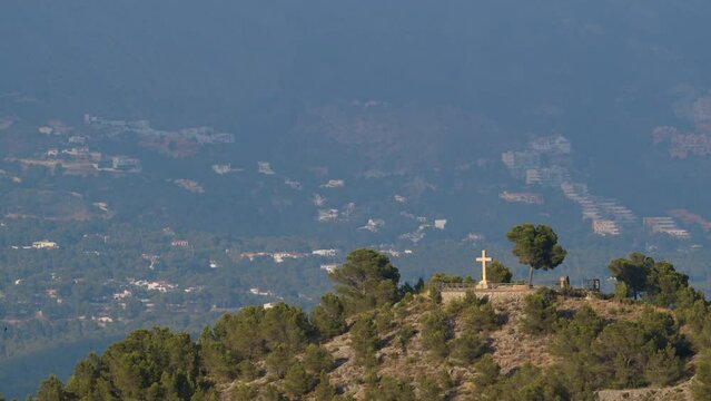 Christian cross on the mountain in La Nucia, Spain