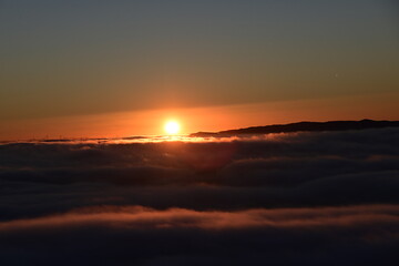 Fototapeta na wymiar sun over the clouds