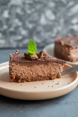 delicious sweet chocolate cake cheesecake in a restaurant mint leaf on a plate