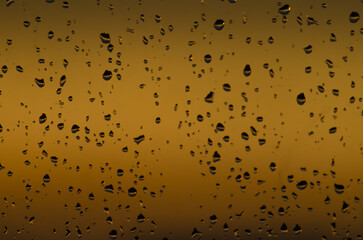 rain drops on the window on sunset