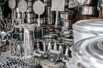 Cooking pots, utensils and souvenirs made from recycled aluminium on display at local market at...