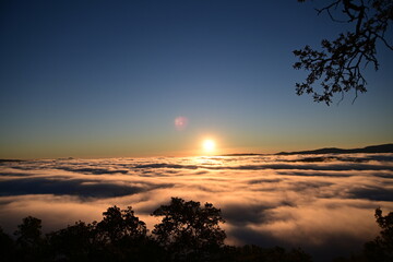 Fototapeta na wymiar sunrise over clouds