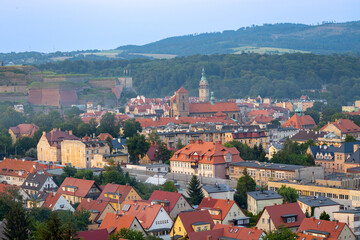 Fototapeta na wymiar Ancient Polish city of Klodzko from above. View of the red tiled roofs from above