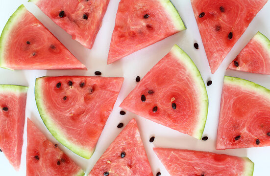 heap of watermelon slices on background