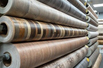Rolls of new linoleum on the window of a hardware store. A large selection of linoleum
