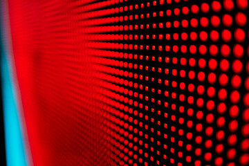 Bright colored blue LED wall with pink pattern - close up background.