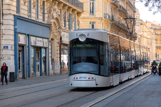 Modern lightrail tram carrying passengers in the streets of Marseille city, France