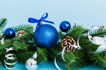 New Year Christmas tree toy, branches of a christmas tree, New Year decorations on a colored background