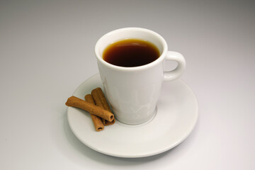 espresso cup with cinnamon sticks