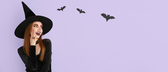 Beautiful woman dressed as witch for Halloween on lilac background with space for text