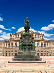 Fototapeta na wymiar Equestrian statue of King Johann of Saxony at Theaterplatz, on the background of the Semperoper. Dresden, Germany