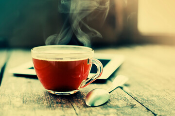 working place background with cup of coffee over rustic background
