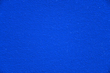 Eine sehr intensive blaue Farbe mit glitzernden Elementen als Hintergrund. Das tiefe Blau erinnert an einen funkelnden und glitzernden Sternenhimmel. 