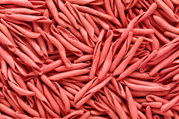 Red trofie pasta with tomatoes from Liguria. Short twisted pasta, top view