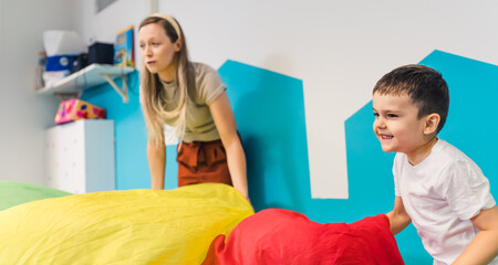 Fototapeta premium children enjoying with their teacher at the nursery. High quality photo