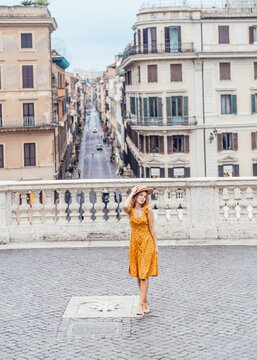 Young Woman In Orange Outfit Stay Overlooking Rome. Spanish Steps. Rome Italy Concept. 