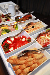 Traditional Turkish appetizer foods (Turkish meze) on the restaurant table.