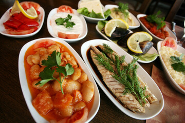 Traditional Turkish appetizer foods (Turkish meze) on the restaurant table.
