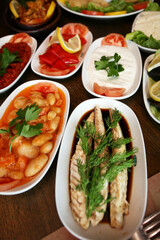 Traditional Turkish appetizer foods (Turkish meze) on the restaurant table.