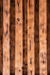 Dark brown wooden plank burned board texture background	