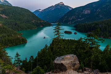 sunrise on the turquoise colored water of Diablo Lake in North Cascades national Park in Washington...