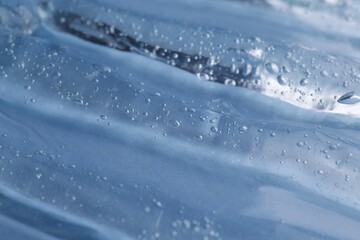 Obraz premium Texture of light blue shower gel as background, closeup