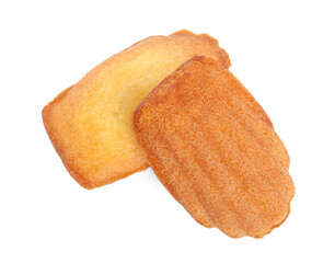 Delicious madeleine cakes on white background, top view