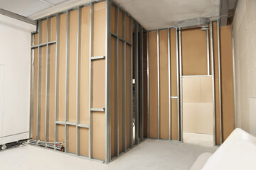 Wall with metal studs indoors. Repair and maintenance