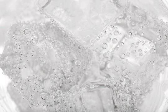 Top view of soda water with ice in glass