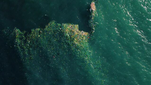 Aerial View Of Garbage Patch Floating In The Rubbish Sea In Vietnam. Water Pollution.