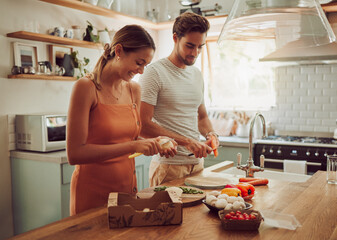 Cooking food, happy and healthy couple preparing a dinner meal in the kitchen together at home....