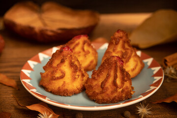 Traditional coconut dessert of the autumn and Christmas season, known as coconut bites, coconut candy, baked coconut and mini coconut sighs