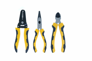 different type of yellow and black pliers hand tools flat lay isolated white background with copy space 