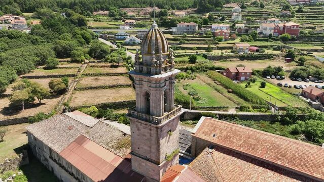 drone view circling the bell tower of the monastery of oia in Santa Maria de oya