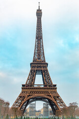Fototapeta na wymiar Romantic Eiffel Tower on a cold cloudy Paris France morning