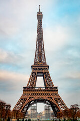 Fototapeta na wymiar Romantic Eiffel Tower on a cold cloudy Paris France morning